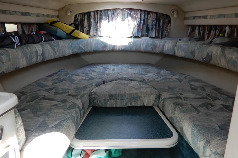 Slide: The Image of Interior cabin of a 1994 Sea Ray 310 Sun Sport boat with patterned seating. - 23