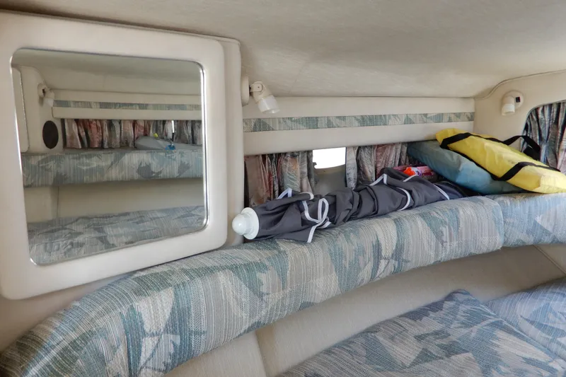 Slide: The Image of Interior cabin of 1994 Sea Ray 310 Sun Sport with seating and storage. - 24