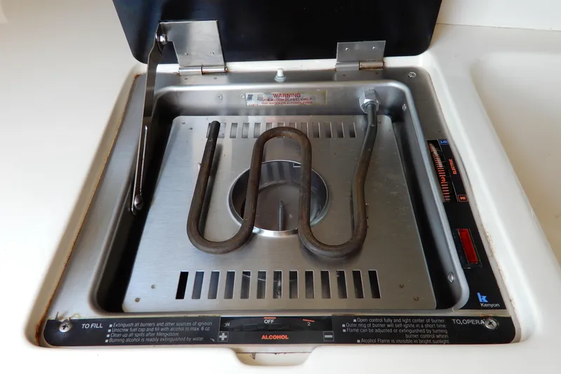 Slide: The Image of Built-in alcohol stove on a 1994 Sea Ray 310 Sun Sport boat. - 28