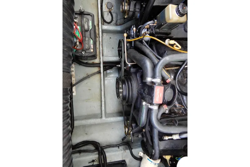 Slide: The Image of Engine compartment of a 1994 Sea Ray 310 Sun Sport boat, showing mechanical components. - 39