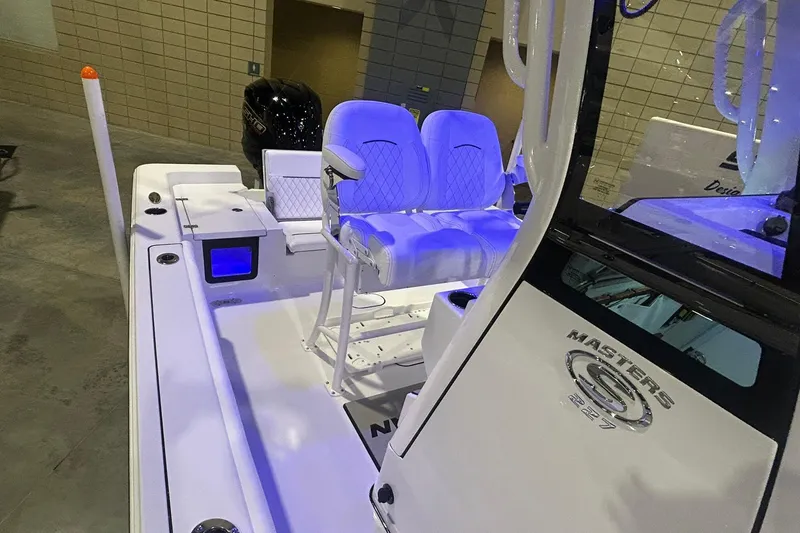 Slide: The Image of 2026 Sportsman Masters 227 Bay Boat interior with illuminated seating and modern design. - 3