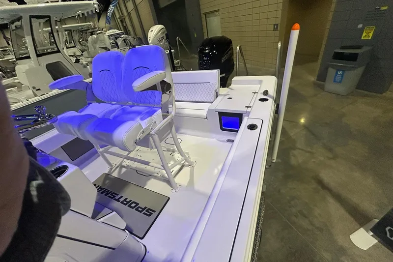 Slide: The Image of 2026 Sportsman Masters 227 Bay Boat interior with illuminated seating and modern features. - 5