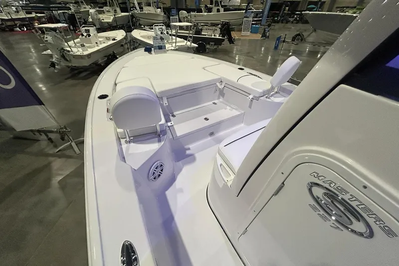 Slide: The Image of 2026 Sportsman Masters 227 Bay Boat interior at a boat show display. - 7