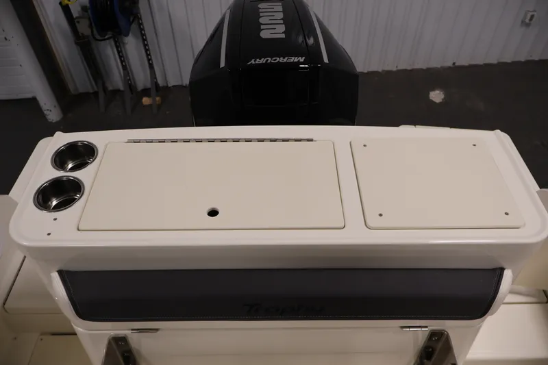Slide: The Image of 2026 Bayliner Trophy T23 Pilothouse boat with Mercury engine, featuring dual cup holders. - 49