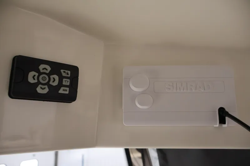 Slide: The Image of Control panel and Simrad device in 2026 Bayliner Trophy T23 Pilothouse boat. - 36