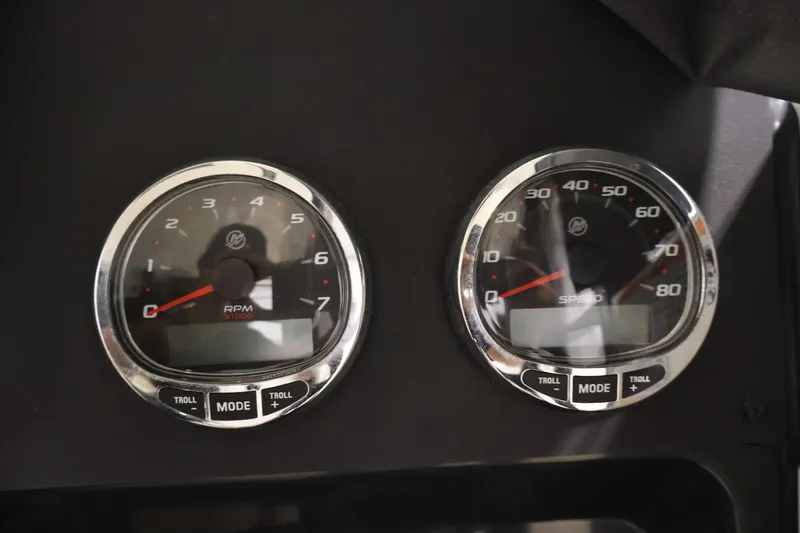 Slide: The Image of Dashboard gauges of 2026 Bayliner Trophy T23 Pilothouse, showing RPM and speed. - 23
