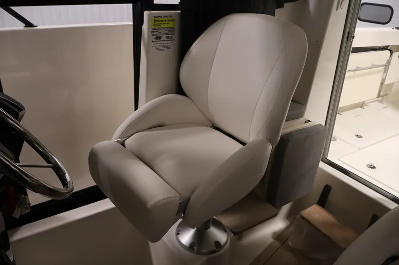 Slide: The Image of Captain's chair in 2026 Bayliner Trophy T23 Pilothouse boat interior. - 29