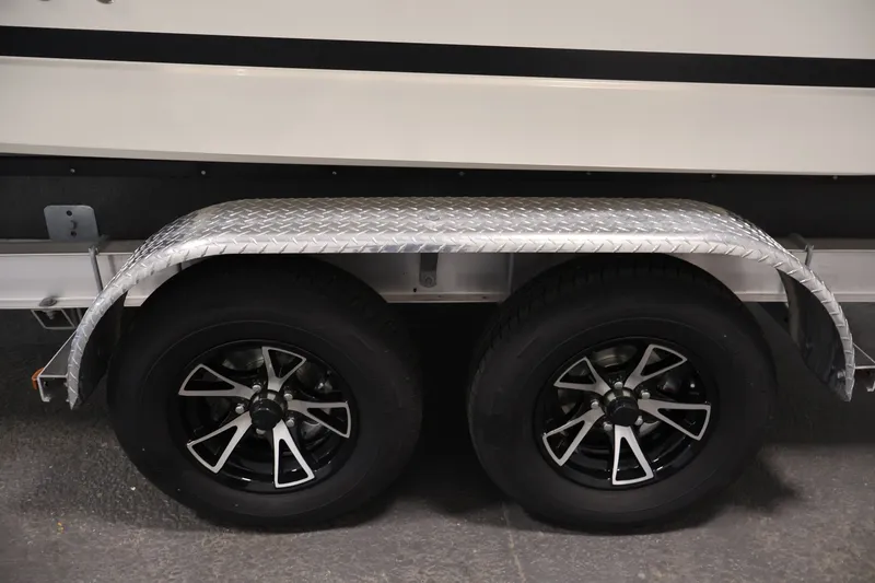 Slide: The Image of Trailer wheels of 2026 Bayliner Trophy T23 Pilothouse with diamond plate fender. - 62