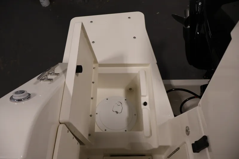 Slide: The Image of Open storage compartment on 2026 Bayliner Trophy T23 Pilothouse boat. - 53