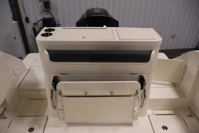 Slide: The Image of 2026 Bayliner Trophy T23 Pilothouse boat interior with storage and seating features. - 47