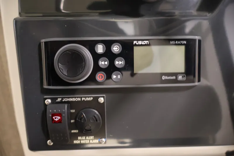 Slide: The Image of Control panel of 2026 Bayliner Trophy T23 Pilothouse with Fusion audio system and Johnson pump. - 26