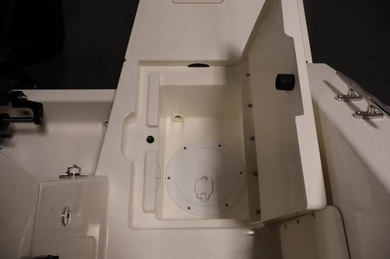 Slide: The Image of 2026 Bayliner Trophy T23 Pilothouse storage compartment with open hatch and secure fittings. - 52