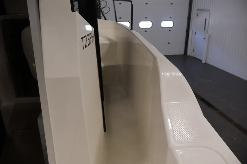 Slide: The Image of 2026 Bayliner Trophy T23 Pilothouse boat interior, showcasing sleek design and craftsmanship. - 16
