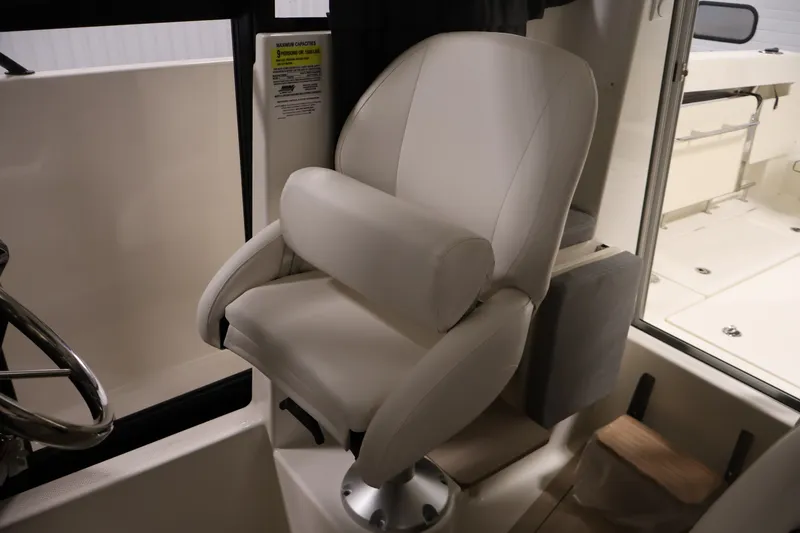 Slide: The Image of Captain's chair in 2026 Bayliner Trophy T23 Pilothouse boat interior. - 30