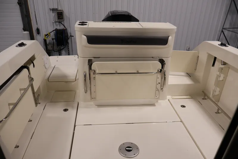 Slide: The Image of 2026 Bayliner Trophy T23 Pilothouse boat interior with spacious deck and storage compartments. - 39