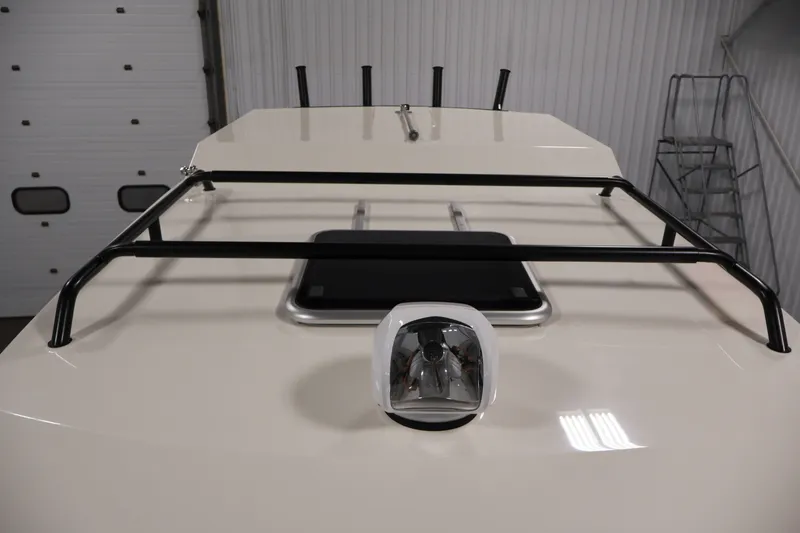 Slide: The Image of 2026 Bayliner Trophy T23 Pilothouse roof with mounted light and railing. - 13