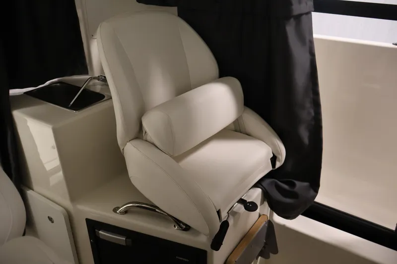 Slide: The Image of Luxurious seating inside 2026 Bayliner Trophy T23 Pilothouse boat cabin. - 32