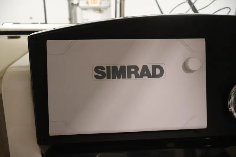 Slide: The Image of Simrad navigation system on 2026 Bayliner Trophy T23 Pilothouse dashboard. - 22