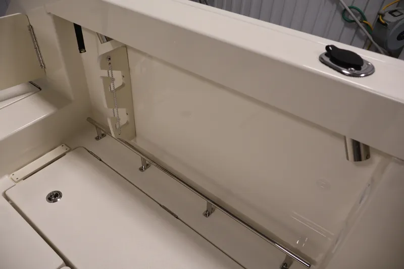 Slide: The Image of Interior view of 2026 Bayliner Trophy T23 Pilothouse boat, showcasing sleek design and storage features. - 46