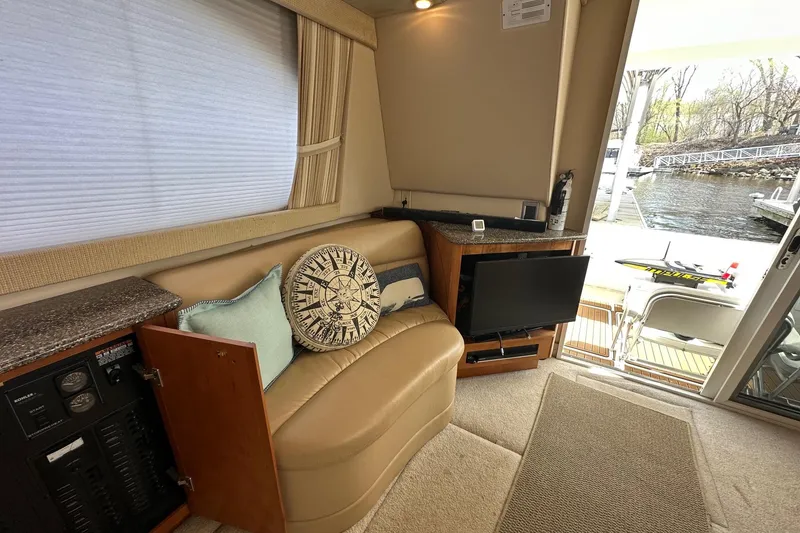 Slide: The Image of Interior of 2003 Meridian 381 Sedan yacht with cozy seating and waterfront view. - 14