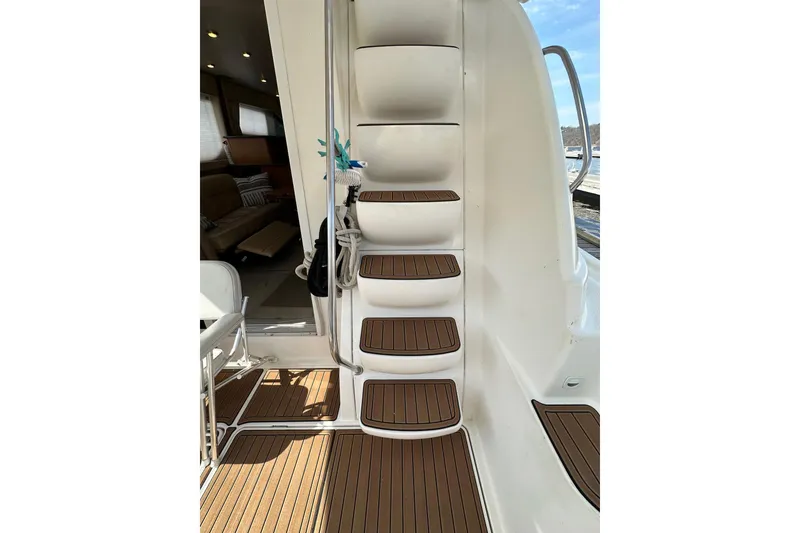 Slide: The Image of Staircase on 2003 Meridian 381 Sedan yacht with teak steps and interior view. - 15