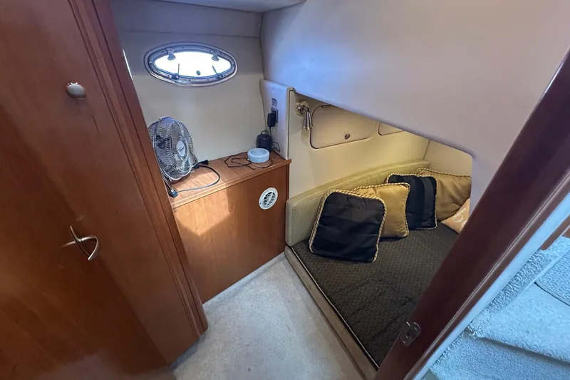 Slide: The Image of Cozy cabin interior of 2003 Meridian 381 Sedan with cushions and fan. - 17