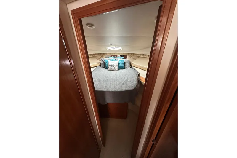 Slide: The Image of Cozy bedroom interior of 2003 Meridian 381 Sedan yacht with stylish bedding. - 22