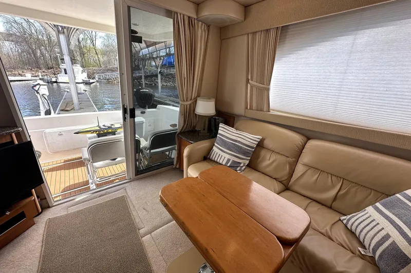 Slide: The Image of Interior of 2003 Meridian 381 Sedan yacht with cozy seating and water view. - 25