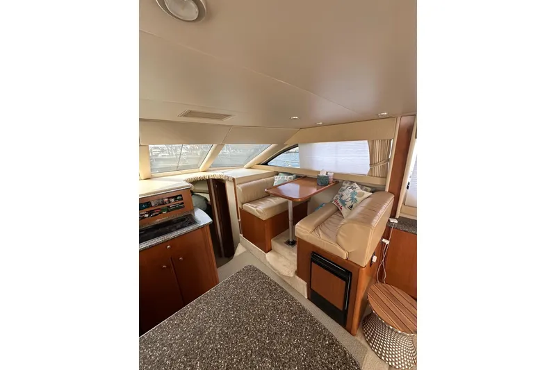 Slide: The Image of Interior of 2003 Meridian 381 Sedan yacht with cozy seating and elegant wood finishes. - 28
