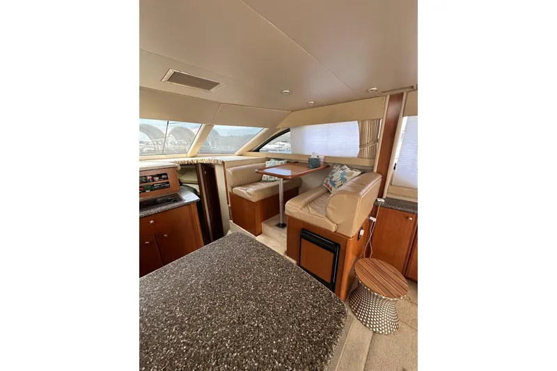 Slide: The Image of Interior of 2003 Meridian 381 Sedan yacht with cozy seating and elegant wood finishes. - 30