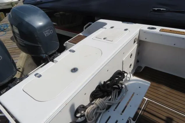 Slide: The Image of 2006 Sea Hunt Triton 260 boat deck with Yamaha 150 engine and coiled ropes. - 3