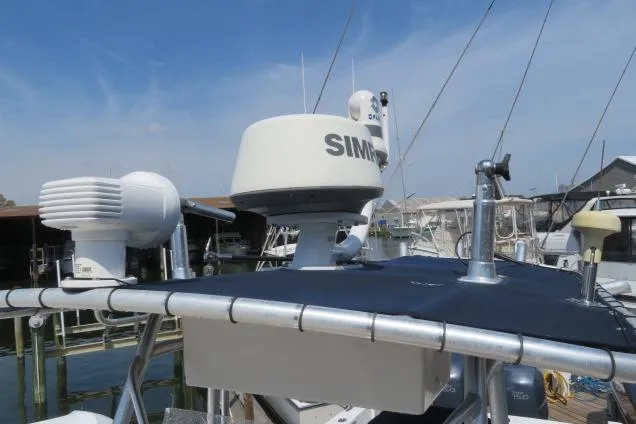 Slide: The Image of 2006 Sea Hunt Triton 260 boat with radar and navigation equipment at a marina. - 36