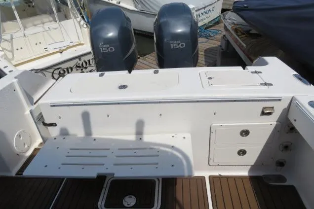 Slide: The Image of 2006 Sea Hunt Triton 260 boat deck with twin Yamaha 150 engines. - 4