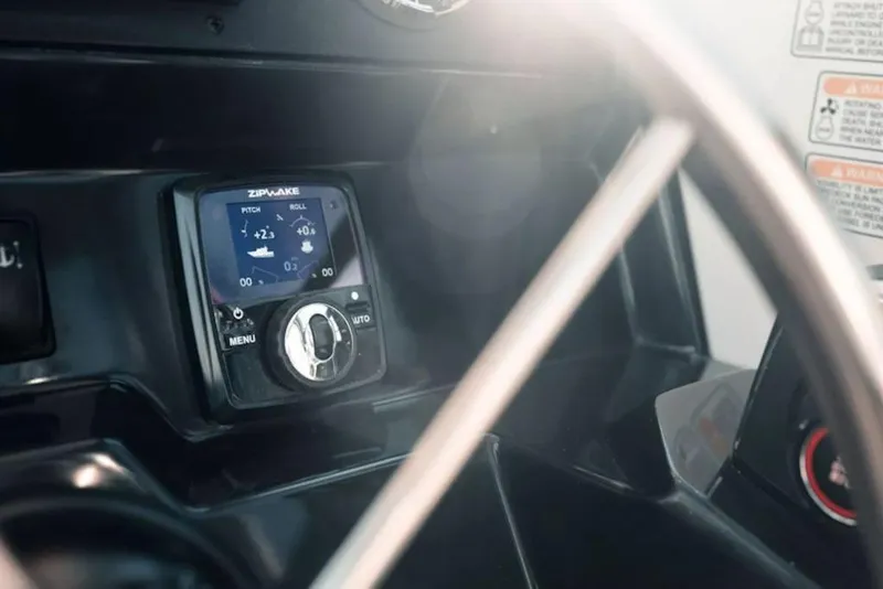 Slide: The Image of Control panel of 2026 Bayliner Trophy T25 Pilothouse with navigation display. - 11