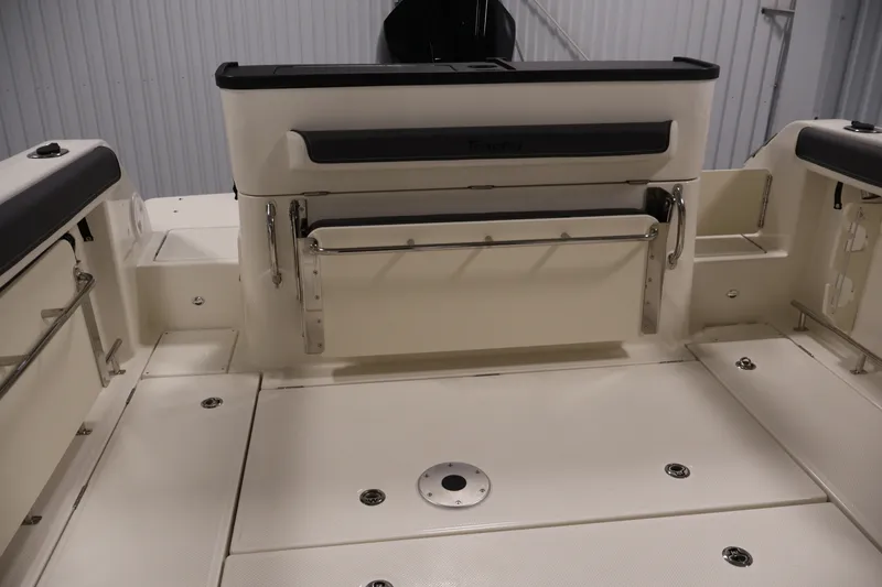 Slide: The Image of 2026 Bayliner Trophy T25 Pilothouse boat interior with seating and storage features. - 63