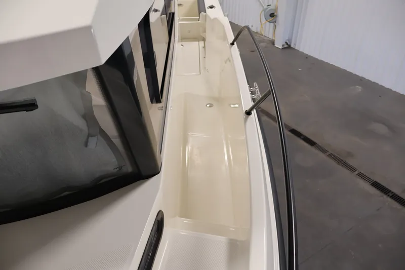 Slide: The Image of 2026 Bayliner Trophy T25 Pilothouse boat deck with sleek design and sturdy railings. - 38