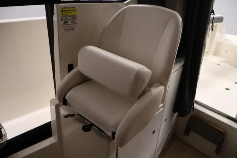 Slide: The Image of Captain's chair in 2026 Bayliner Trophy T25 Pilothouse boat interior. - 54