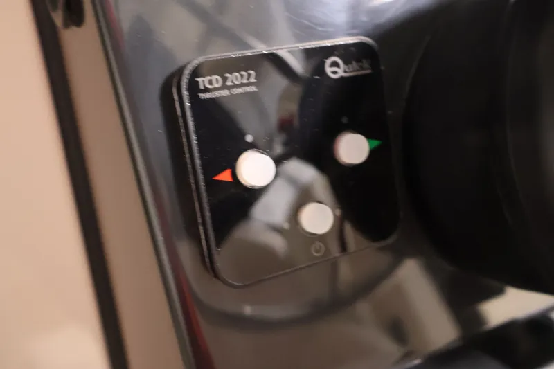 Slide: The Image of Control panel of 2026 Bayliner Trophy T25 Pilothouse boat, featuring thruster controls. - 47