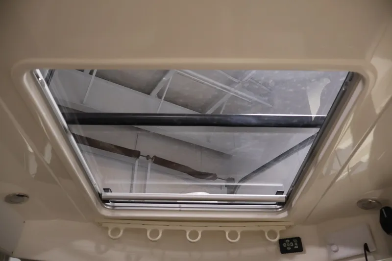 Slide: The Image of Skylight view inside 2026 Bayliner Trophy T25 Pilothouse boat cabin. - 51