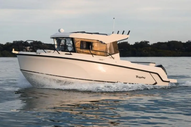 Slide: The Image of 2026 Bayliner Trophy T25 Pilothouse cruising on calm water. - 7