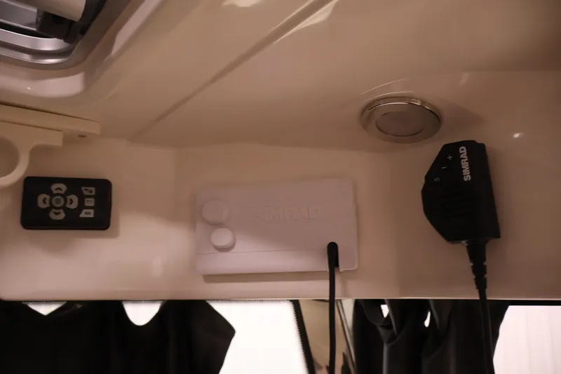 Slide: The Image of 2026 Bayliner Trophy T25 Pilothouse interior electronics and controls. - 50
