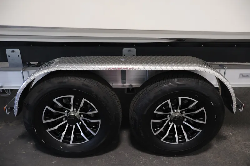 Slide: The Image of Trailer wheels of 2026 Bayliner Trophy T25 Pilothouse with diamond plate fender. - 79