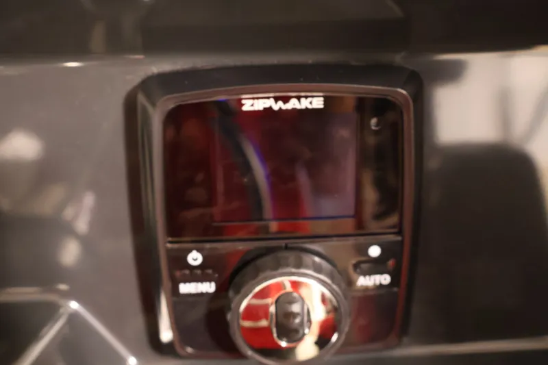Slide: The Image of Zipwake control panel on 2026 Bayliner Trophy T25 Pilothouse boat dashboard. - 46