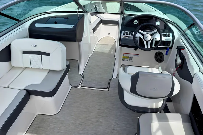 Slide: The Image of Interior of a 2019 Regal 21 OBX boat with modern seating and steering wheel. - 10