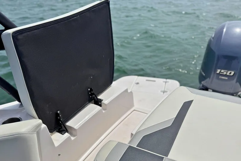 Slide: The Image of 2019 Regal 21 OBX boat interior with Yamaha 150 engine on water. - 12