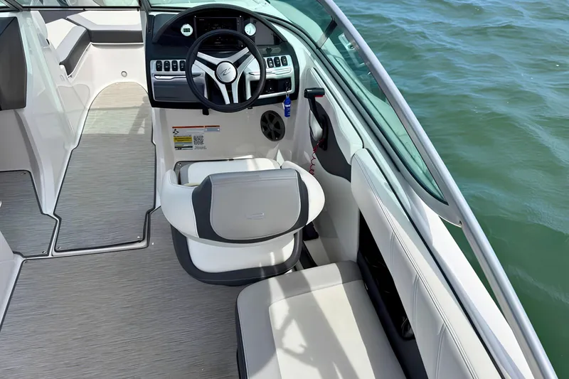 Slide: The Image of Interior view of 2019 Regal 21 OBX boat with steering wheel and seating. - 14