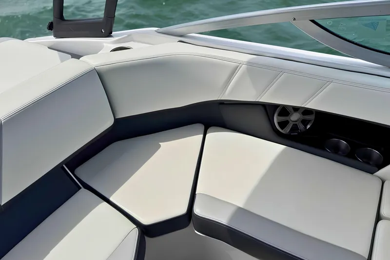 Slide: The Image of 2019 Regal 21 OBX boat interior with cushioned seating and speaker system. - 17
