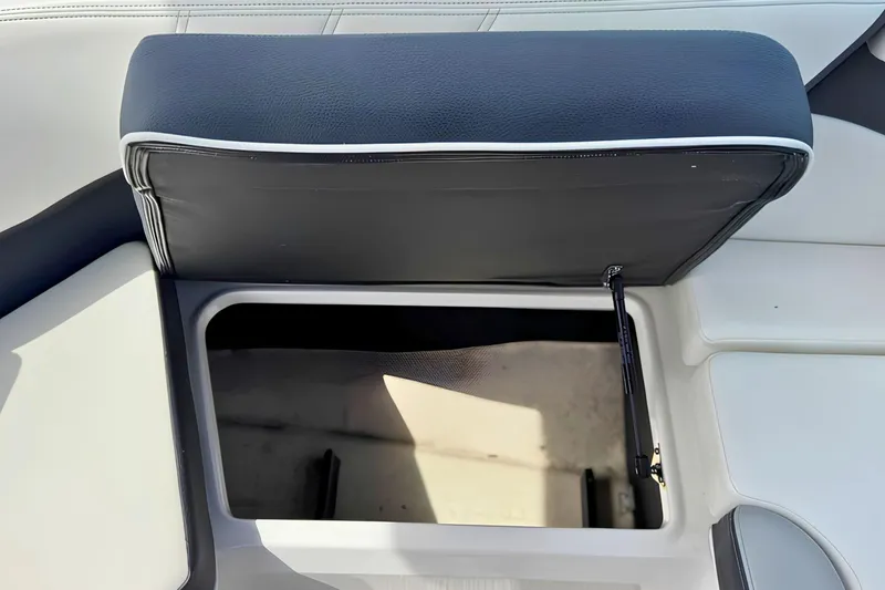 Slide: The Image of Open storage compartment in 2019 Regal 21 OBX boat seat. - 18