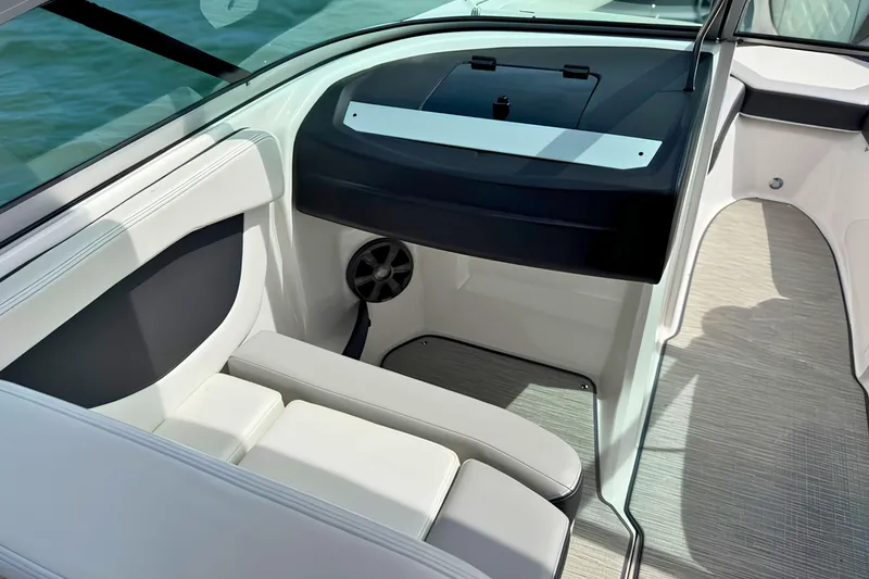 Slide: The Image of Interior view of a 2019 Regal 21 OBX boat, featuring sleek seating and modern design. - 21