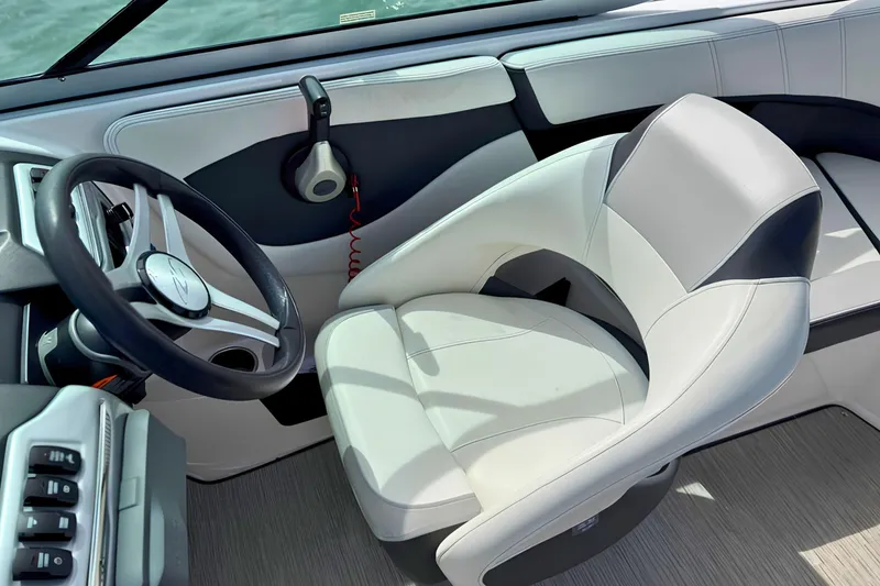 Slide: The Image of 2019 Regal 21 OBX boat interior with steering wheel and captain's seat. - 23